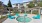 a hot tub surrounded by blue chairs