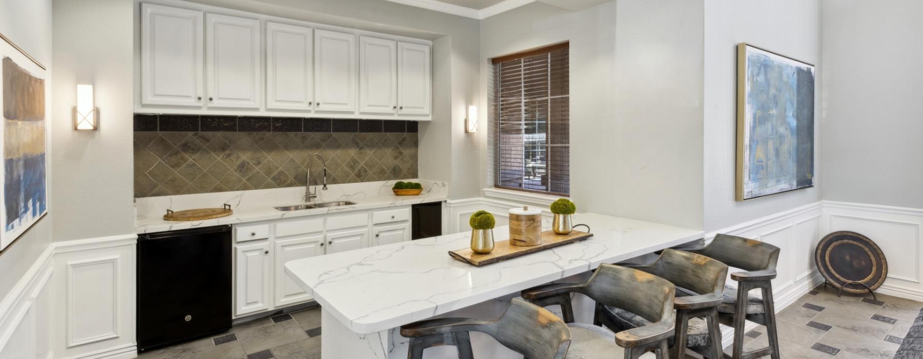 a kitchen with white cabinets