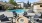a pool with chairs around it