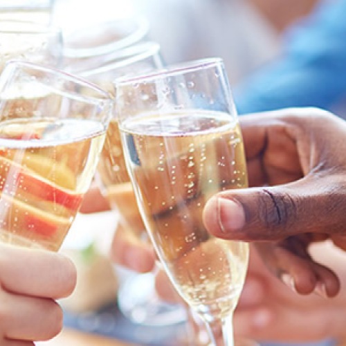 The essence of exceptional living	 people toasting champagne