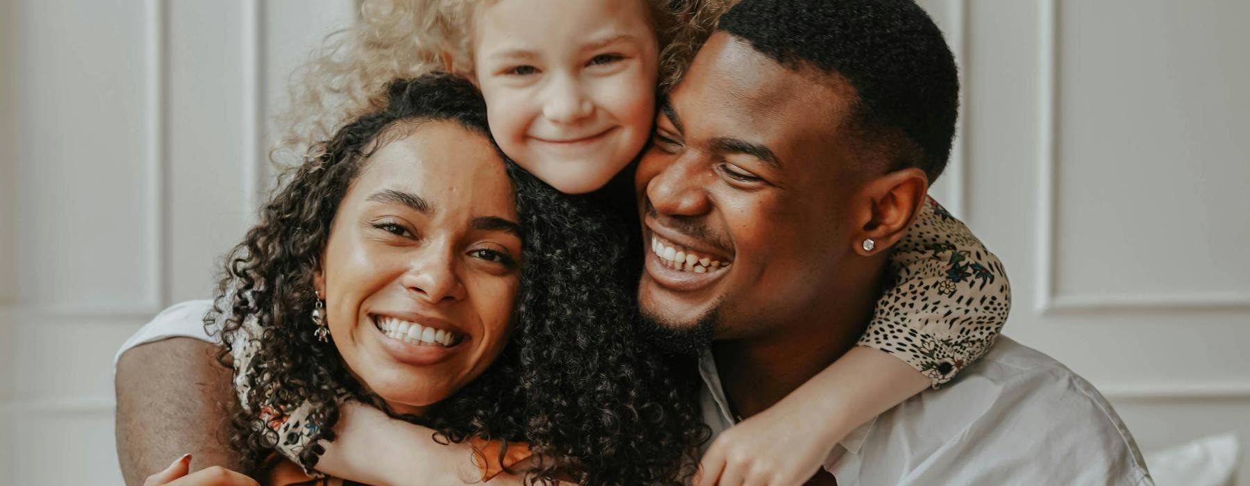 a man and woman with a child